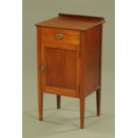 An Edwardian mahogany bedside cabinet, with rear upstand,