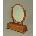 An Edwardian inlaid mahogany oval toilet mirror,