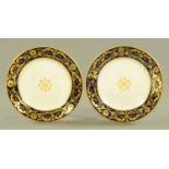 A pair of 19th century Derby plates, with blue and gilt rims, printed mark to base. Diameter 22 cm.