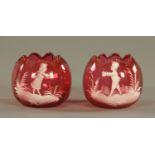 A pair of Mary Gregory style cranberry glass bowls, 19th century,