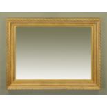 A large gilt framed mirror, with acorn and oak leaf moulded frame. Overall 150 cm x 120 cm.