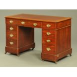 A late Victorian pedestal desk, with leather writing surface,