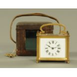 A brass carriage clock, rectangular, timepiece only, complete with carrying case and key. Width 9.