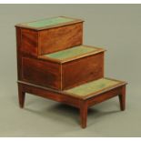 A 19th century mahogany step commode, with green gilt tooled leather tread inserts. Width 55 cm.