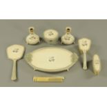 A vintage dressing table set, comprising tray, mirror, candlesticks, brushes and powder bowl.