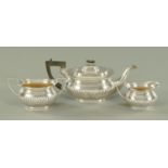 A silver plated three piece tea set, early 20th century, with part reeded bodies.