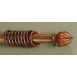 A large Victorian curtain pole, complete with rings. Length 236 cm.