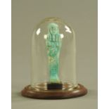 An Egyptian Faience Shabti figure, turquoise. Height including stand 12.5 cm (see illustration).