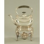 A silver plated spirit kettle, with stand and burner. Height 30 cm.