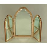 An Art Deco pink and clear glass triple dressing table mirror. Height 67 cm, width open 84 cm.