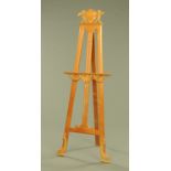 A Venetian pine adjustable easel. Height 170 cm, width across table 57 cm.