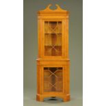 An oak standing corner cabinet,