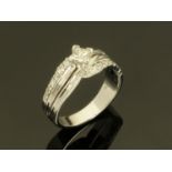 An 18 ct white gold three row diamond ring, centre diamond +/- 0.35 carats.
