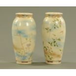 A pair of Japanese Satsuma vases, decorated with butterflies and branches with flowers.