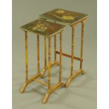 Two gilt painted glass topped occasional tables,