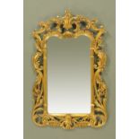 A Chippendale style wall mirror, with foliate and scroll carved frame, circa 1930.