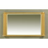 A 19th century gilt framed overmantle mirror, with bevelled glass and moulded side columns.