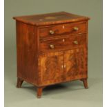 An early 19th century mahogany commode,