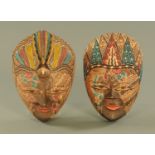 Two Indonesian masks. Height 29 cm.