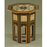 A Moorish octagonal inlaid mother of pearl occasional table, of typical form. Width 61 cm.