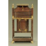 A Shoolbred attributed oak and brass hall stick stand, of typical form and complete with drip tray.