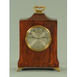 An inlaid mahogany mantle clock, with brass carrying handle,