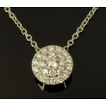 An 18 ct white gold diamond cluster pendant, diamond weight +/- 0.55 carats, cluster diameter 9 mm.