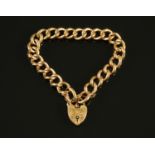 A 9 ct gold hollow link bracelet, with foliate engraved padlock and safety chain, 18.