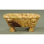 A Grand Tour style carved marble model of a Roman bath, 41 cm wide, 17 cm high (see illustration).