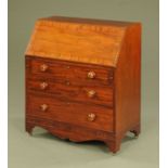A 19th century mahogany bureau, with crossbanded flap and fitted interior,