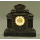 A late Victorian black slate architectural mantle clock,