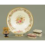 A Royal Worcester porcelain bowl, two patch boxes, Royal Crown Derby miniature urn and pin dish.
