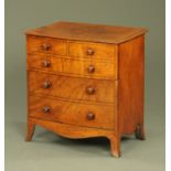 An early 19th century bowfronted commode,