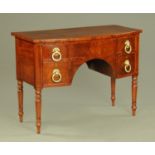 A Regency mahogany bowfronted small sideboard or dressing table,