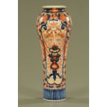 A 19th century Imari vase, decorated in typical Imari colours. Height 41 cm.
