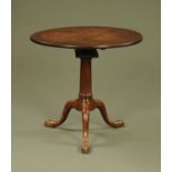 A George III mahogany tripod table, with circular top,