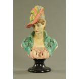 An Edwardian painted plaster bust, a lady wearing a hat. Height 50 cm.