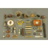 A miscellaneous collection, including whistles, badges, corkscrew, spoon, etc.