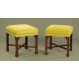 A pair of Chippendale style stools,