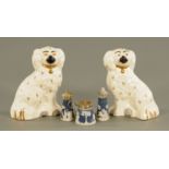 A pair of Beswick Staffordshire spaniels, with painted faces and gilt collars, height 19.