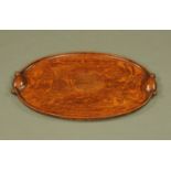 An Edwardian oval oak tray, length 61 cm.