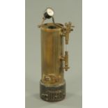 A vintage brass model of a steam boiler, height 34 cm.