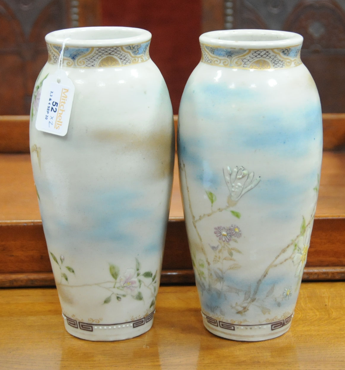 A pair of Japanese Satsuma vases, decorated with butterflies and branches with flowers. - Image 3 of 7