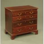 A George III mahogany chest of drawers,