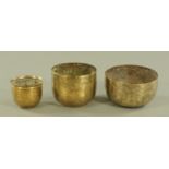 Three Benares bowls, with typical decoration. Largest diameter 20 cm.