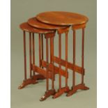 An Edwardian inlaid mahogany oval nest of three tea tables. Widest 56 cm.