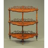 A Victorian walnut three tier whatnot stand,