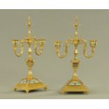 A pair of champleve enamel and brass two branch candelabra,