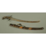 A 19th century Middle Eastern short sabre, blade 53 cm, with ribbed horn grip and brass hilt,