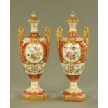 A pair of Continental porcelain lidded vases, hand painted with floral sprays and signed L Monet.
